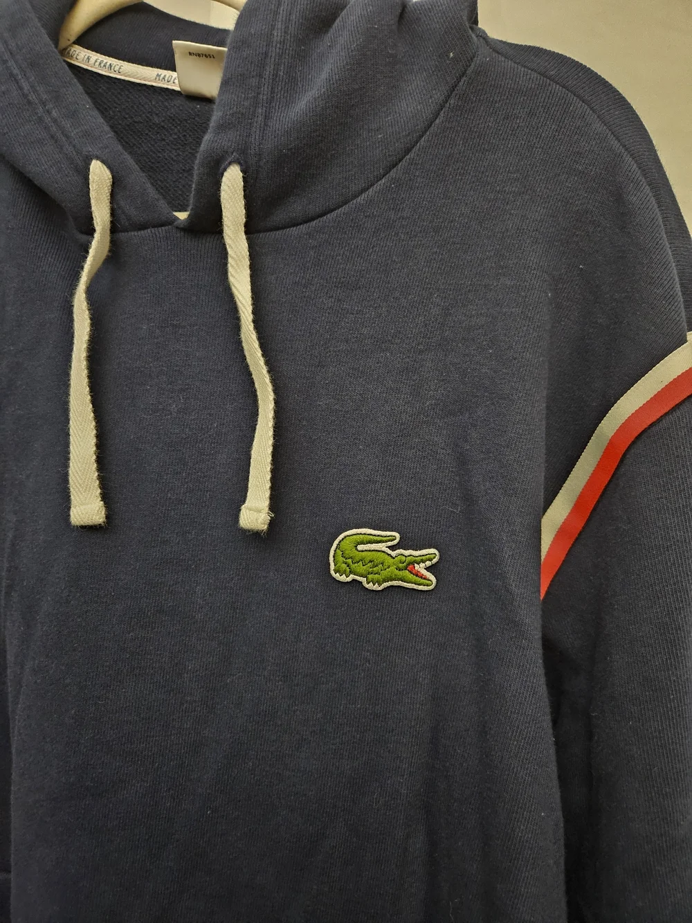 Lacoste Navy Pullover Hoodie with Red and White Shoulder Stripes
